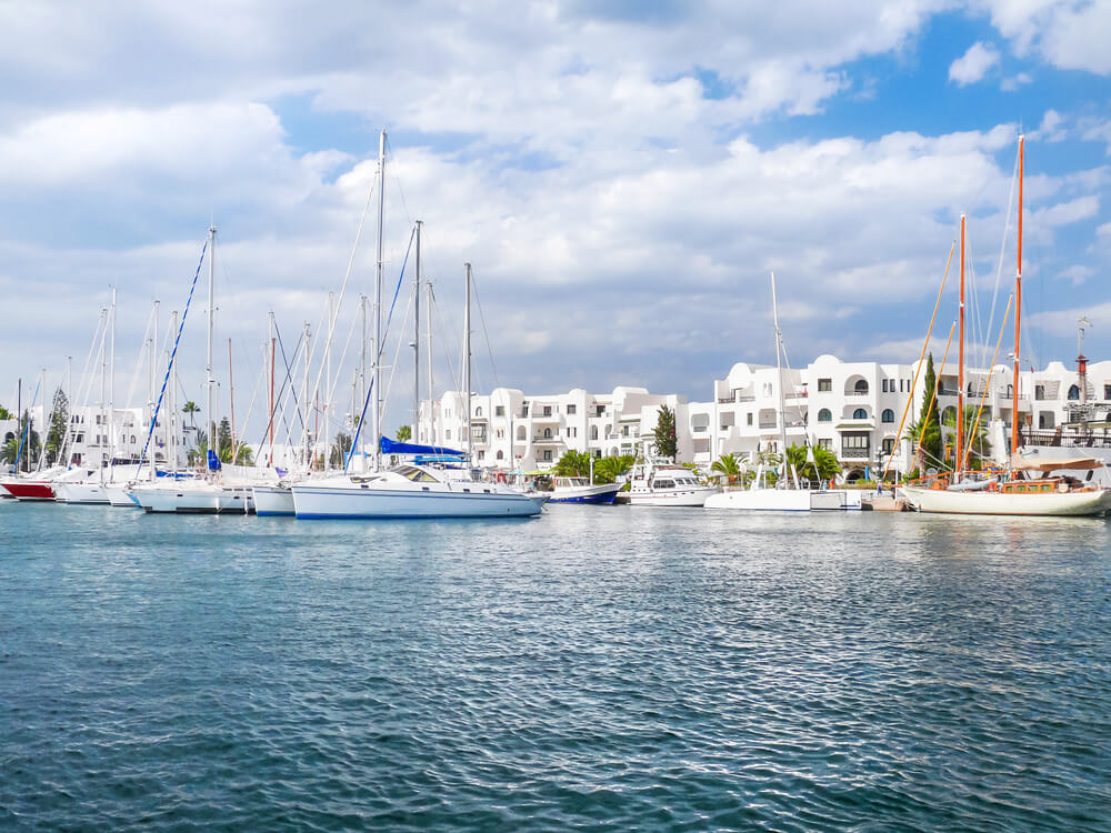 Yachts rest at the whitewashed marina in Port El Kantaoui