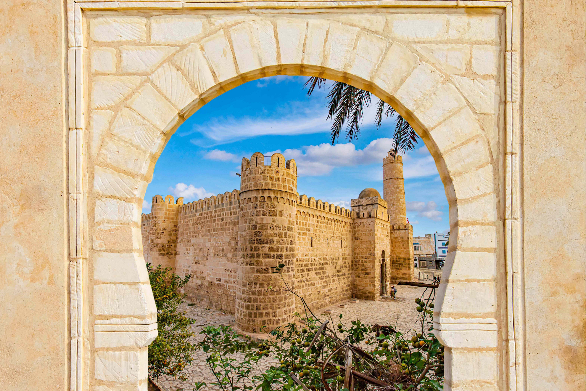 Attractions in Sousse: the stone Ribat of Sousse framed by a horseshoe arch