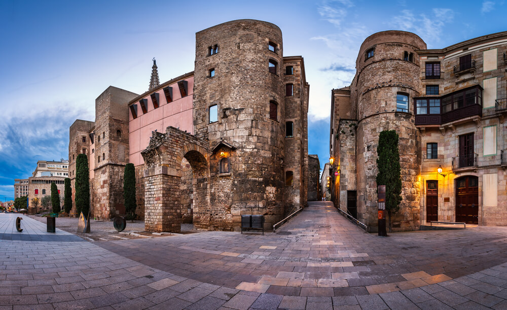 Barcelona Old Town: Old city walls of Barcelona viewed across a patio