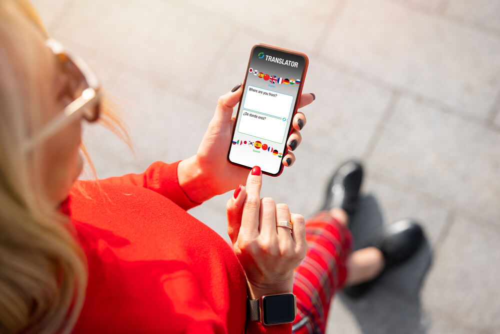 Basic Spanish travel phrases: translation app on phone