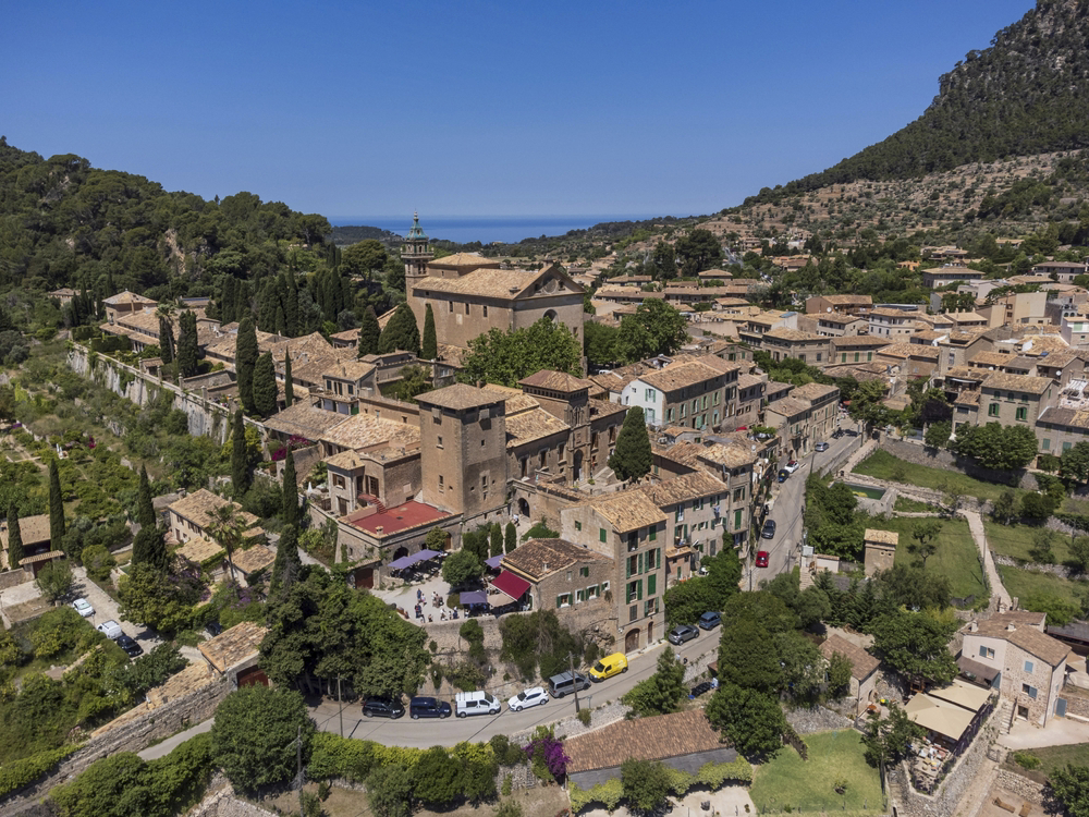 Beautiful towns in Mallorca: an aerial shot of the sandstone mountain village of Valldemossa