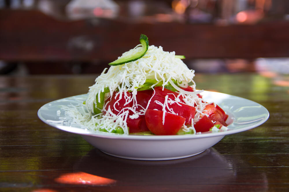 Bulgarian cuisine: close-up of a dish of Bulgarian Shopska salad