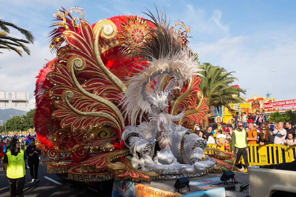 Carnival in the Canary Islands: A woman dressed in carnival dress on a float