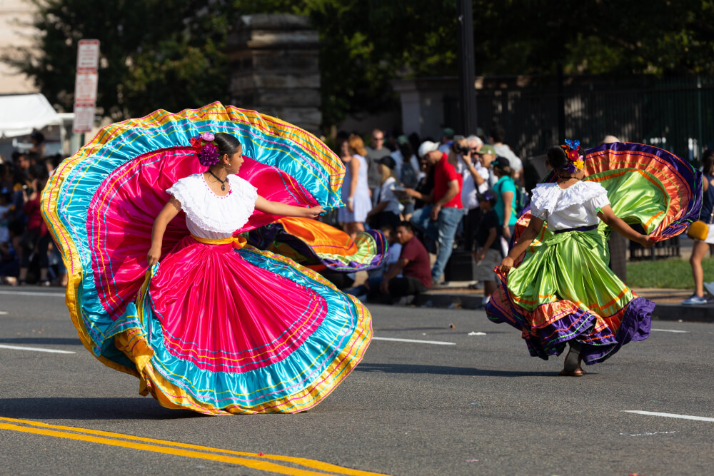 Costa Rican culture can be observed in these women’s dresses