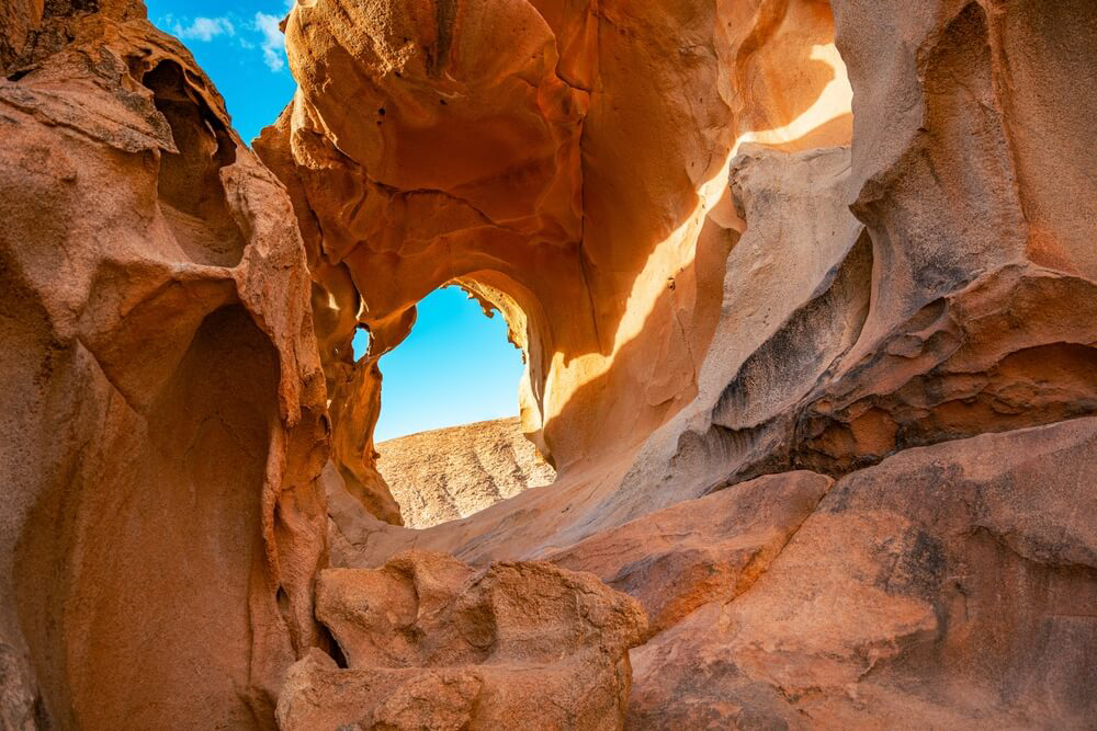 A dramatic sandstone arch carved into the rock by the elements
