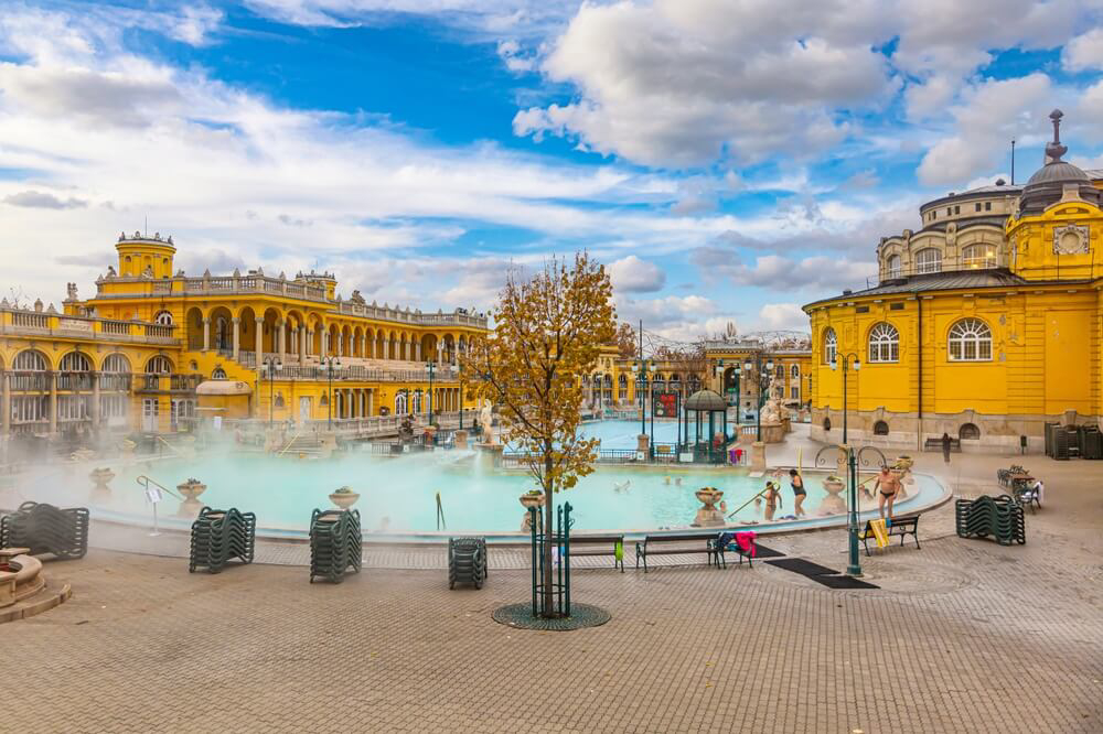 The iconic yellow buildings of Széchenyi Baths in Budapest