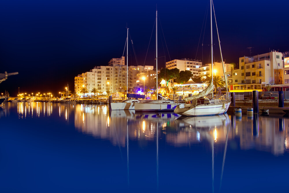 Ibiza Nightlife: A yacht in the port of San Antonio at sundown