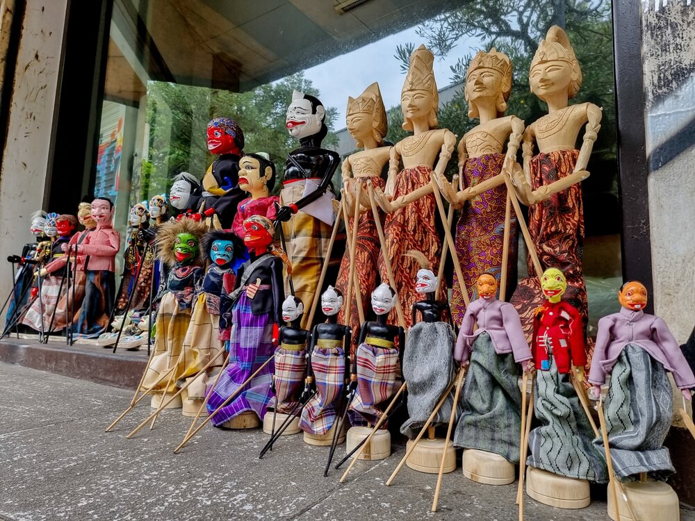Rows of wooden puppets for traditional wayang theatre