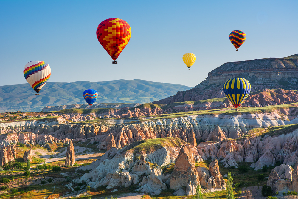Colourful hot-air balloons over the stunning scenery of Cappadocia