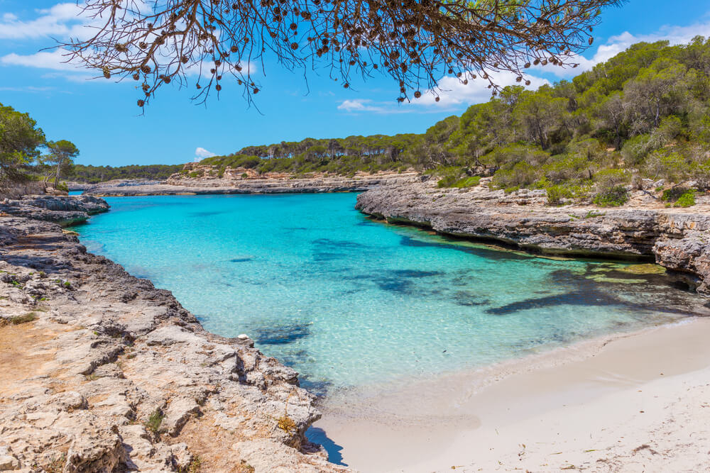 Mondragó: A paper white sand cove and a topaz blue sea surrounded by greenery