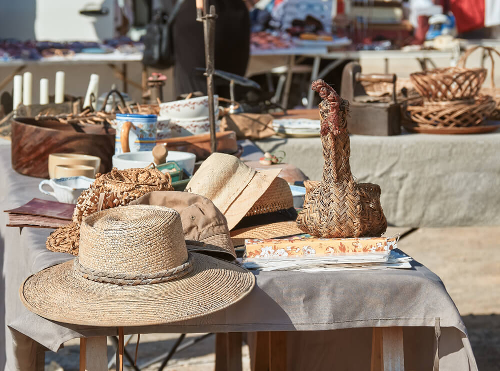 Sant Jordi: A table with a cream tablecloth and bric-a-brac on top