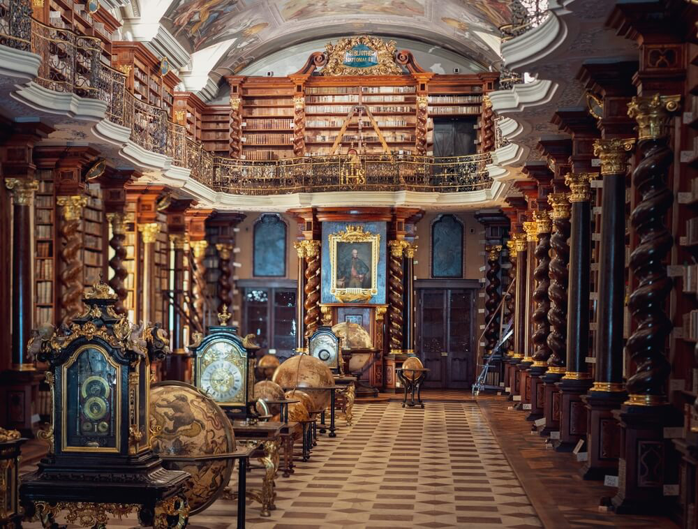 National Library: A wooden library with a painted ceiling and globes