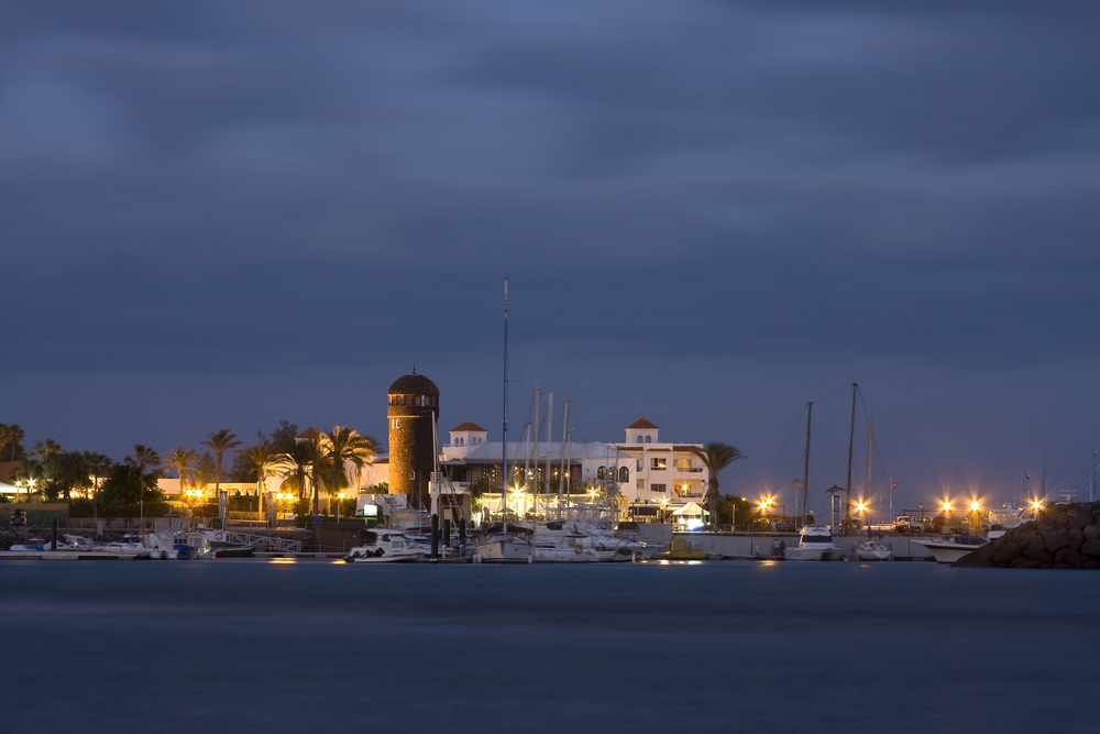 Nightlife in Fuerteventura: Caleta de Fuste marina seen from the water at night