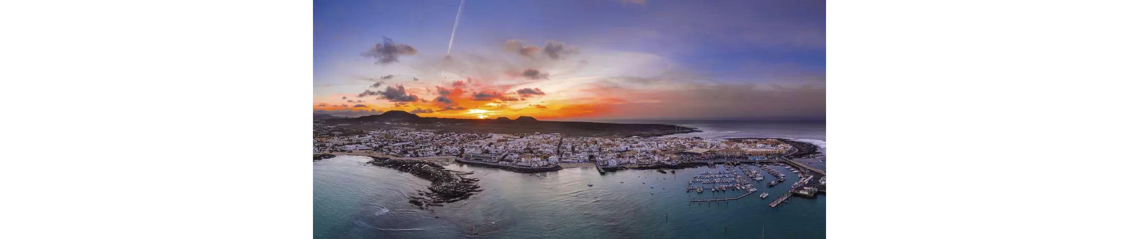 Nightlife in Fuerteventura: an aerial view of Corralejo at sunset