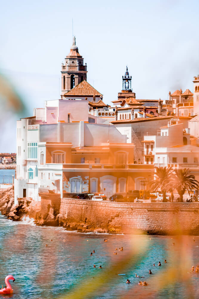 Places to visit near Barcelona: a view of central Sitges and church overlooking the sea