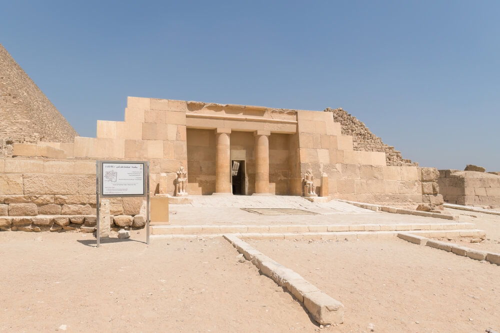 Mastaba: A low-lying limestone brick building with columns next to the pyramids