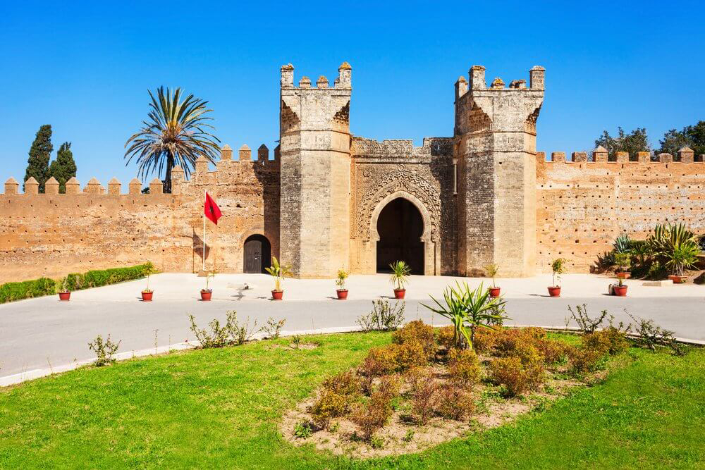 Chella Necropolis: The ornate entrance of the Chella Necropolis surrounded by gardens