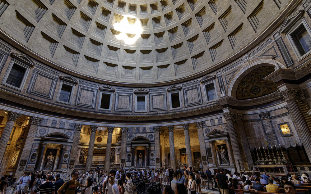 Interior of the Pantheon dome with sunlight shining through the oculus