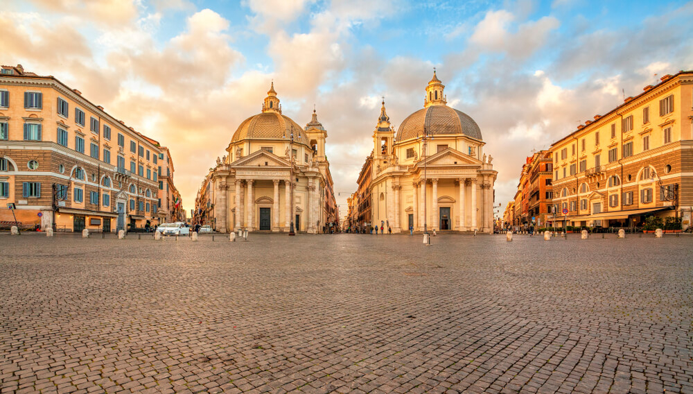 Piazza del Popolo and its twin churches in a yellow light