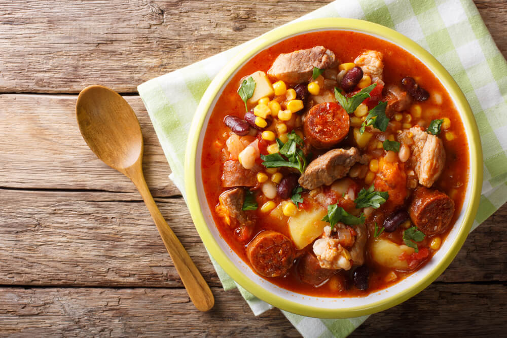 Cachupa: A bowl of tomato stew with beans and meat