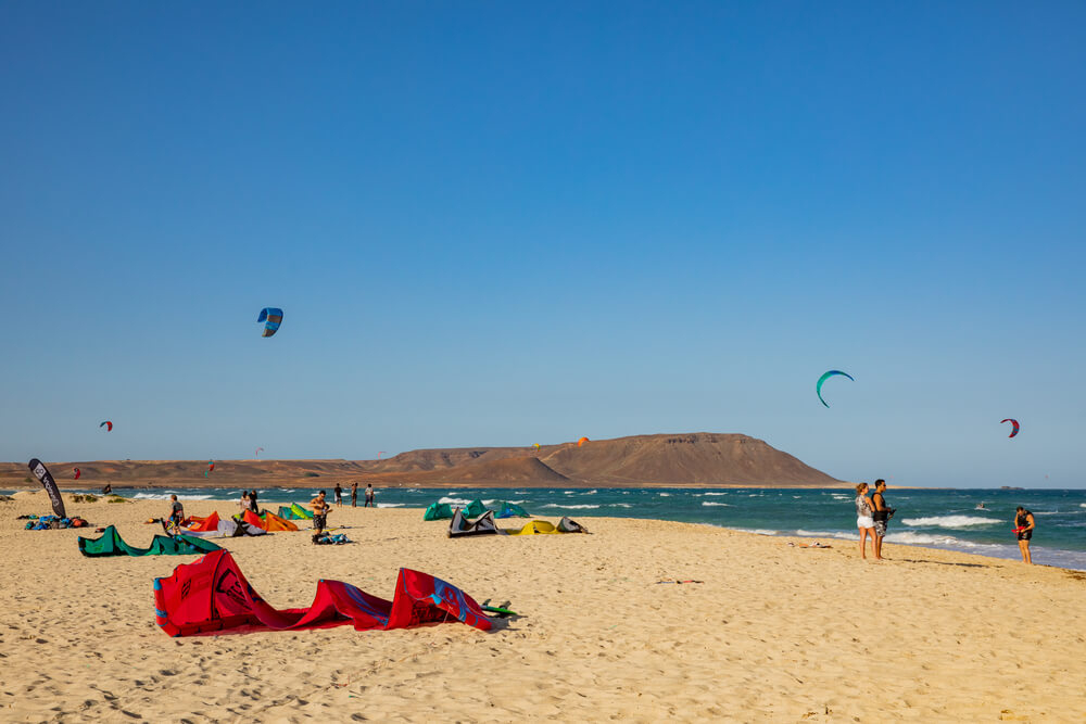 Kite Beach: A golden sand beach with kite surfers by the shore