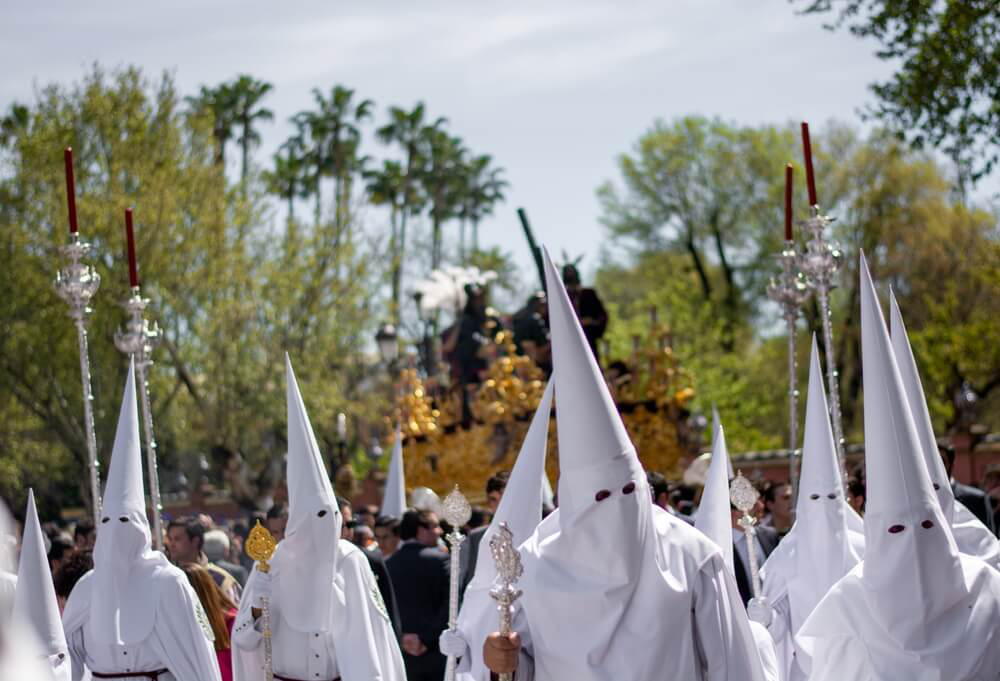 Semana Santa: A group of men dressed in white hooded robes