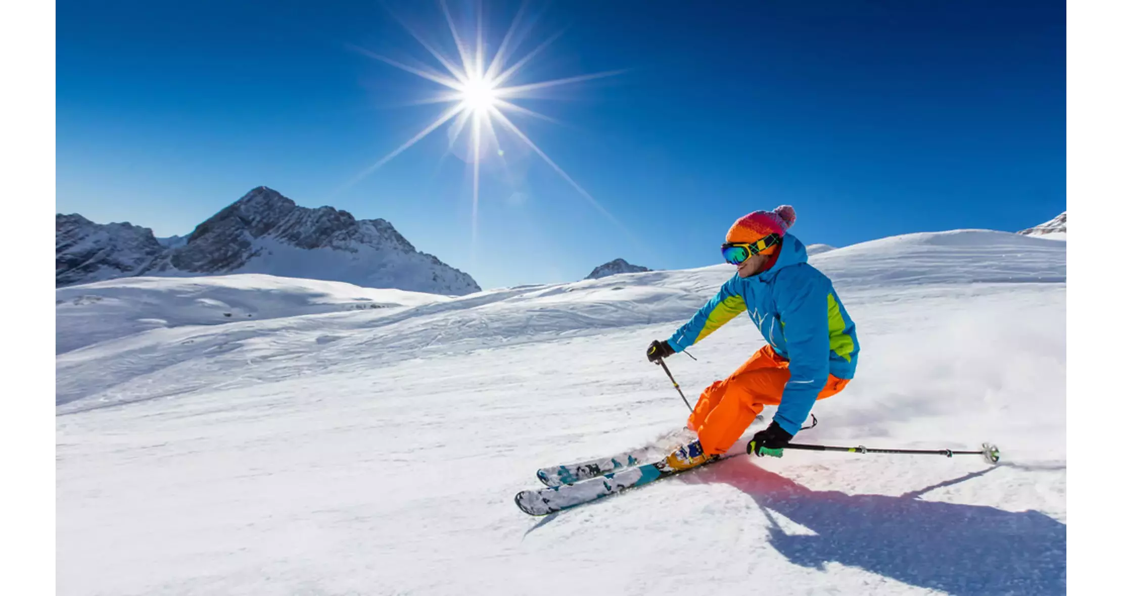 Skiing in Spain: A man skiing down the mountain in the sunshine