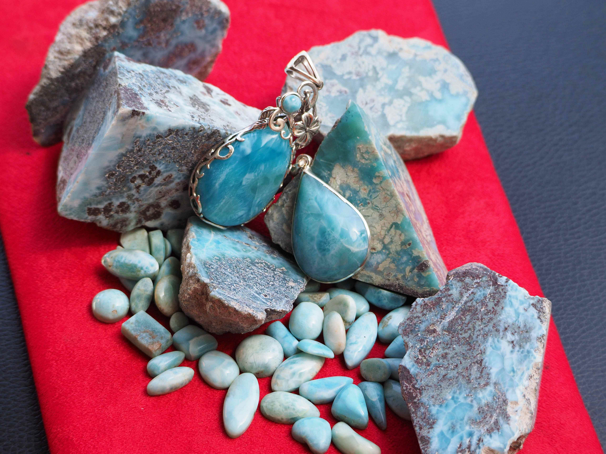 Larimar displayed on a red carpet, a great souvenir from the Dominican Republic