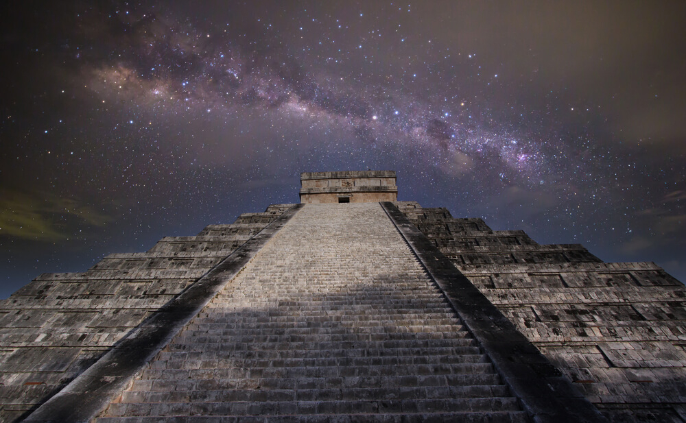 A night view of a pyramid at the Mayan ruins of Chichen Itza.