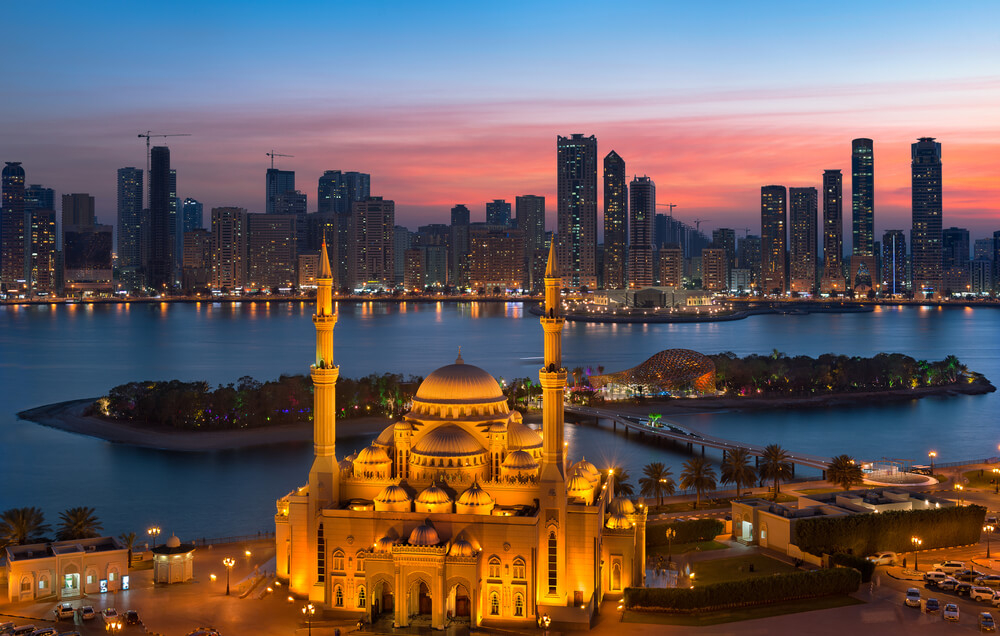 Al Khalid: A view of Sharjah’s skyline at night with the Al Noor mosque and island