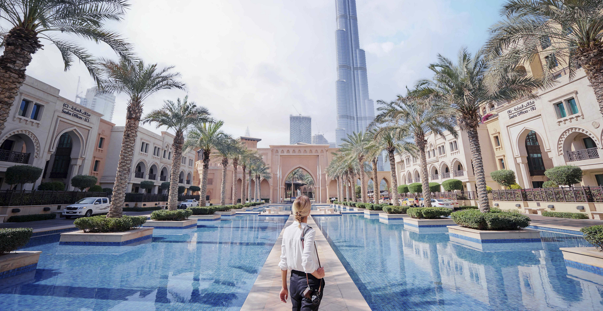 A view of the Dubai skyline from an arched window