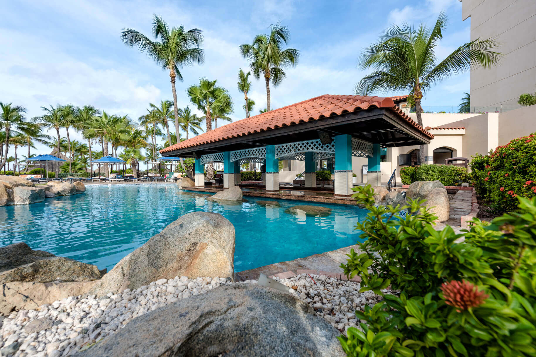 The pool at this hotel is a great place to relax after a day of Aruba water sports.