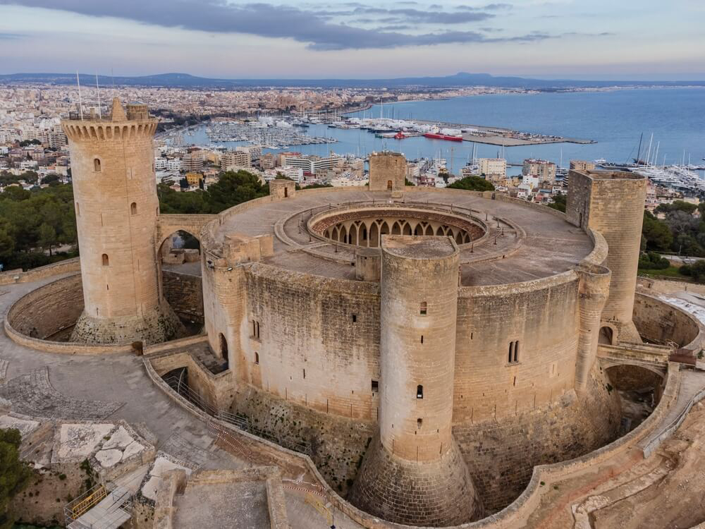Bellver Castle: A bird’s eye view of the castle and grounds with the sea in the background