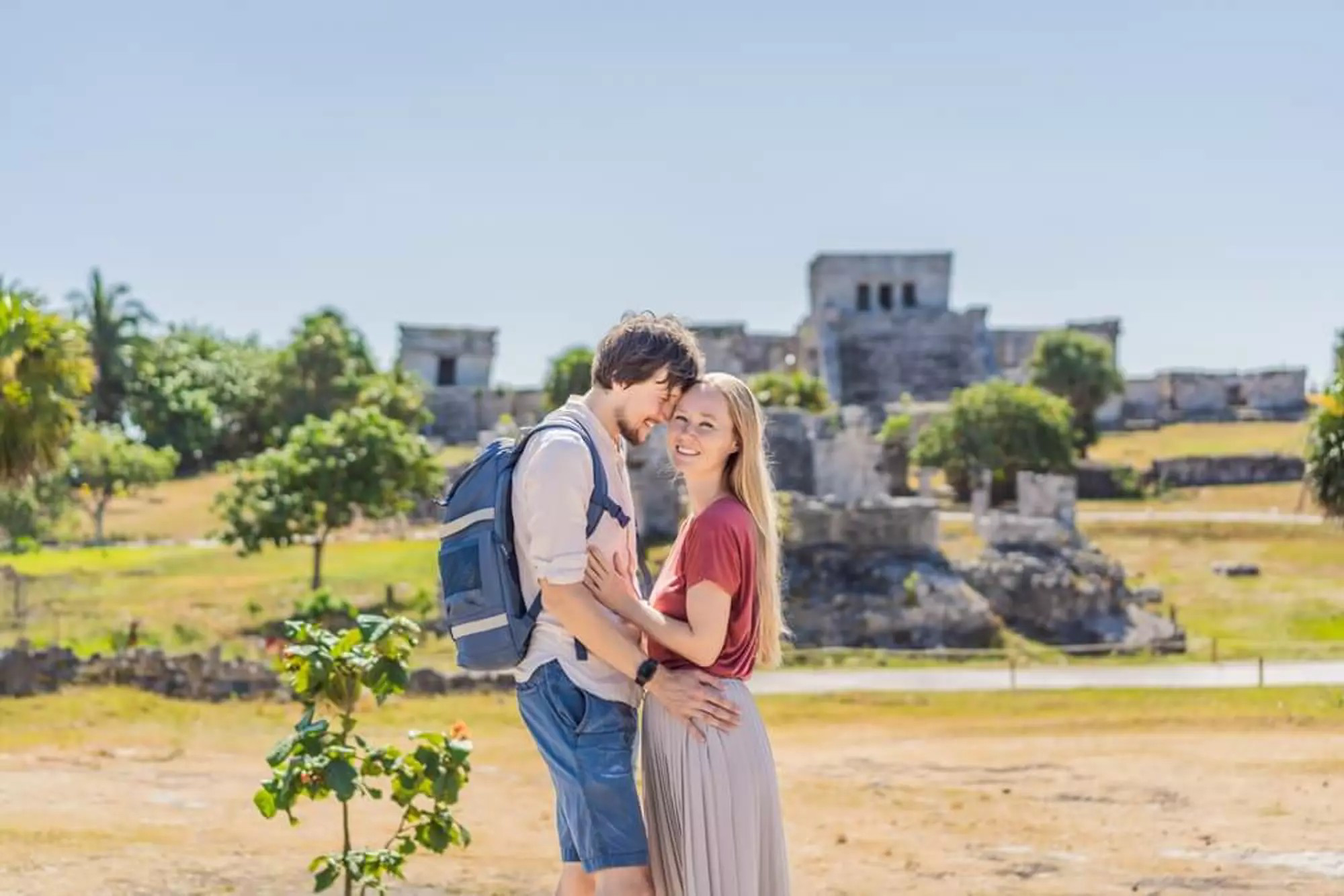 A couple poses in front of Tulum’s ruins on Valentine’s Day in Mexico.