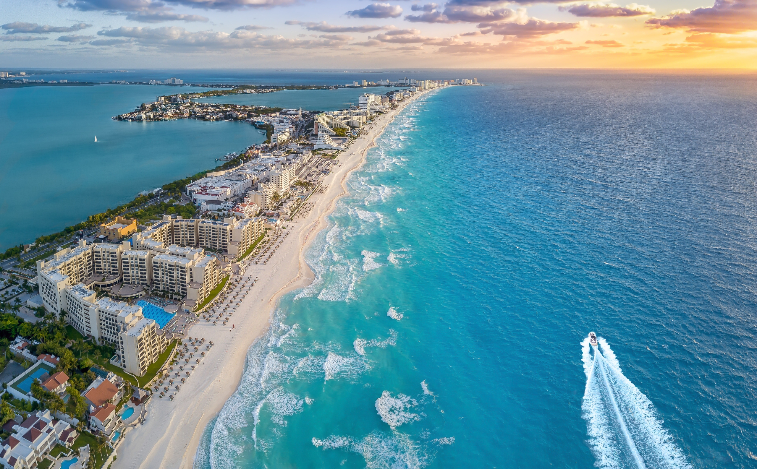 Blue Monday Holiday Deals: White shoreline and turquoise sea with resorts