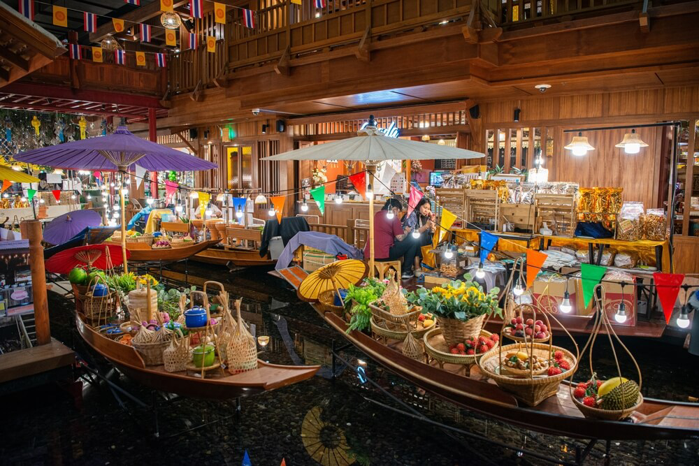 Food in Thailand: Boats stacked full of fresh produce at an open air market