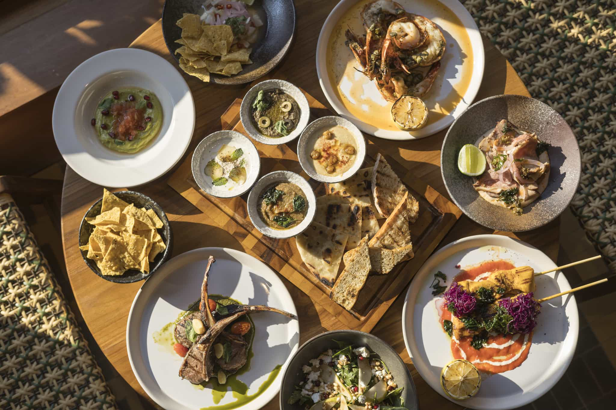 Food in Thailand: A low table full of different plates of Thai food