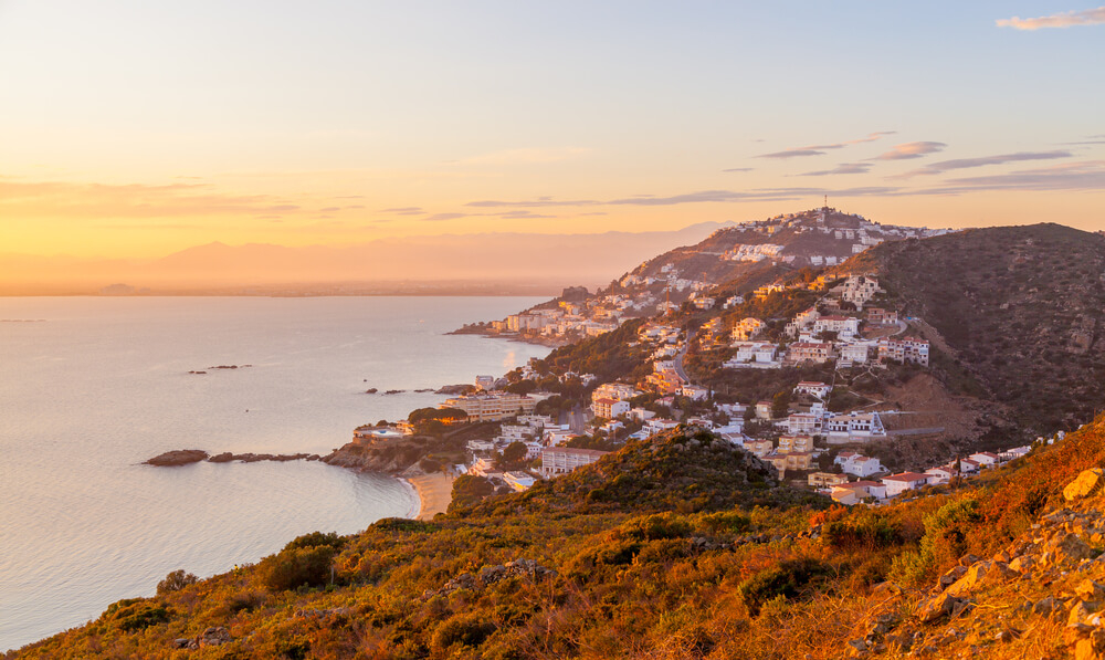 Things to do in the Costa Brava: A bird’s eye view of Roses, Girona across the bay at sunset