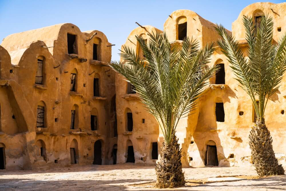 Ksar Ouled Soltane: A wall of cave-style dwellings built into the wall in Tataouine