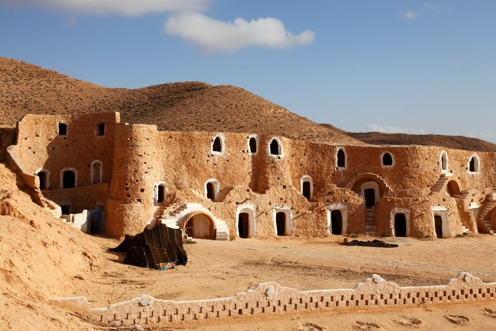 Matmata: Golden hills with a wall of houses built into them