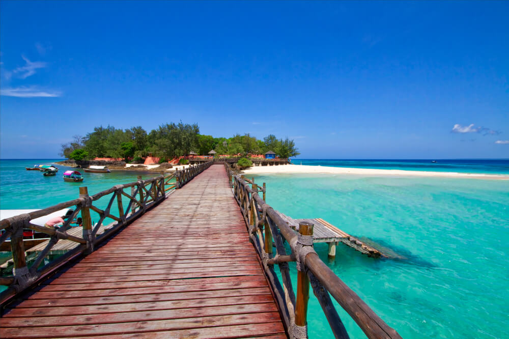 Prison Island: A view of Prison Island from the other side of a wooden promenade 