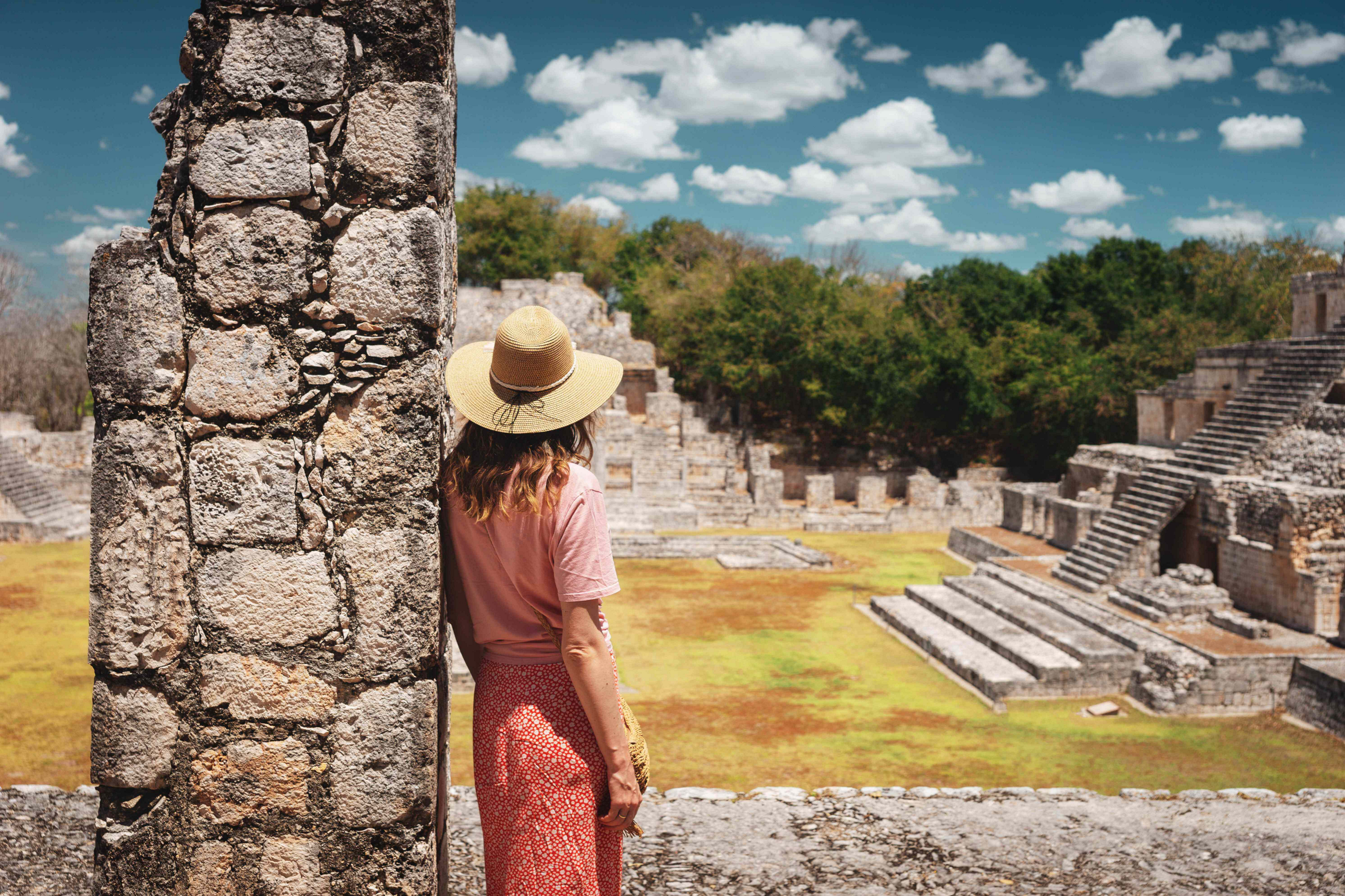 Travel through Mexico: Lady looking out over Mexican ruins